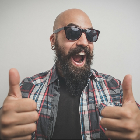 happy guy with shaved head and facial hair