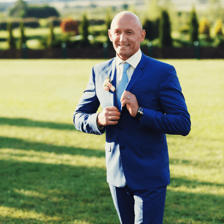 Bald groom with stubble beard on wedding day