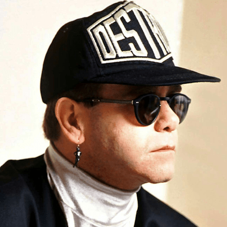 elton john wearing hat and sunglasses