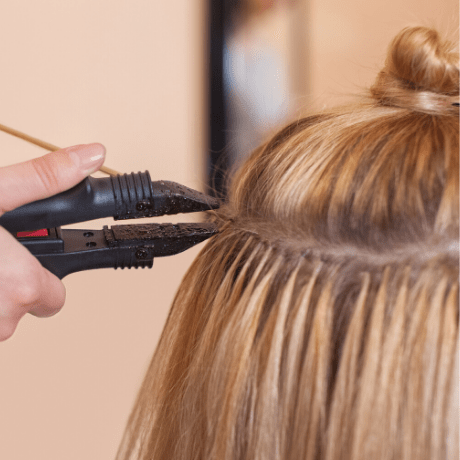 hair extentions being put in