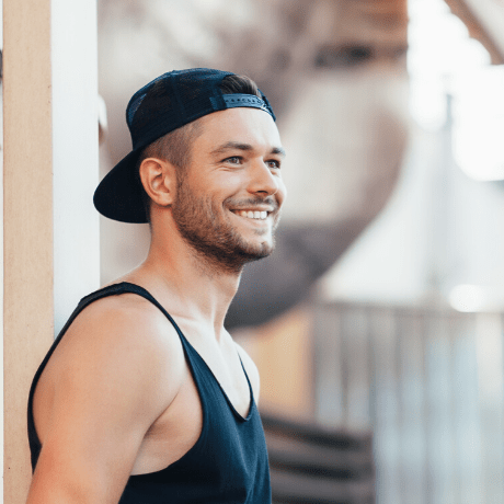 man wearing cap and vest