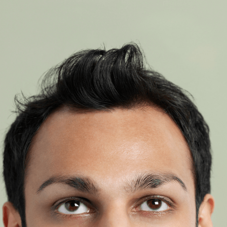  man with messy hat hair